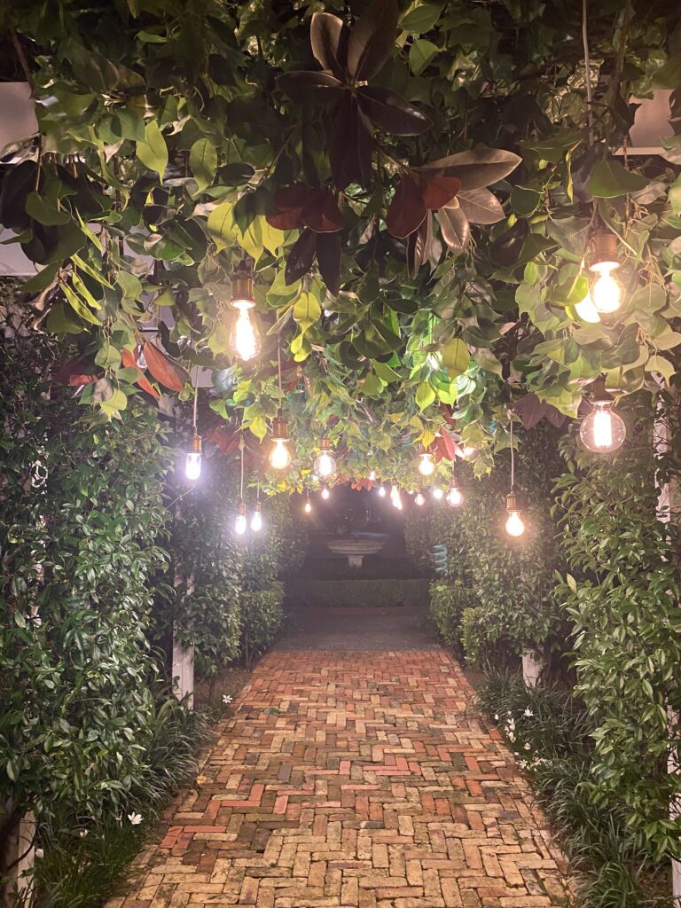 Antique Edison Bulbs in a hanging greenery bay